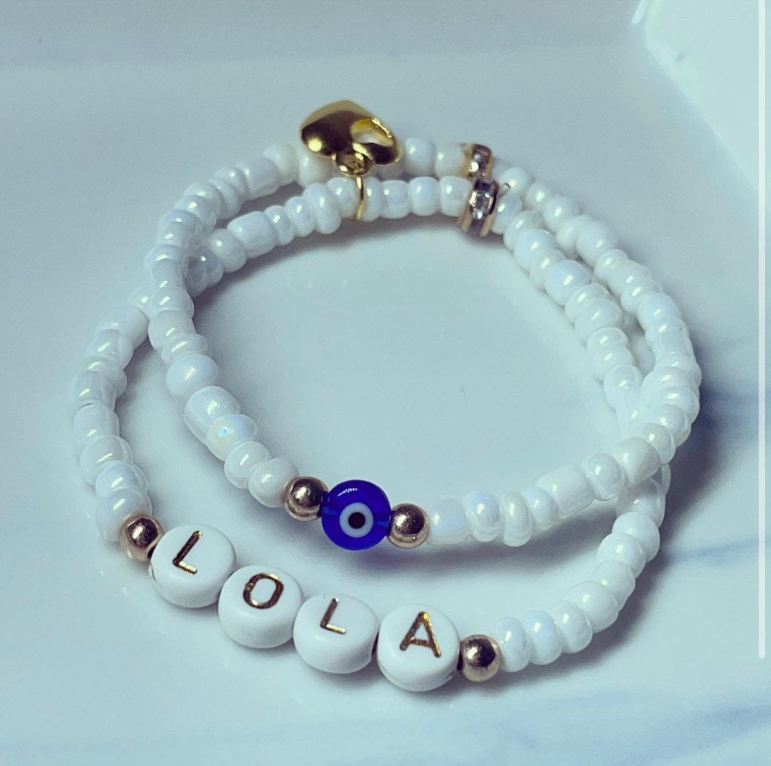 Personalised Pearl white glass bead stack of bracelets with evil eye