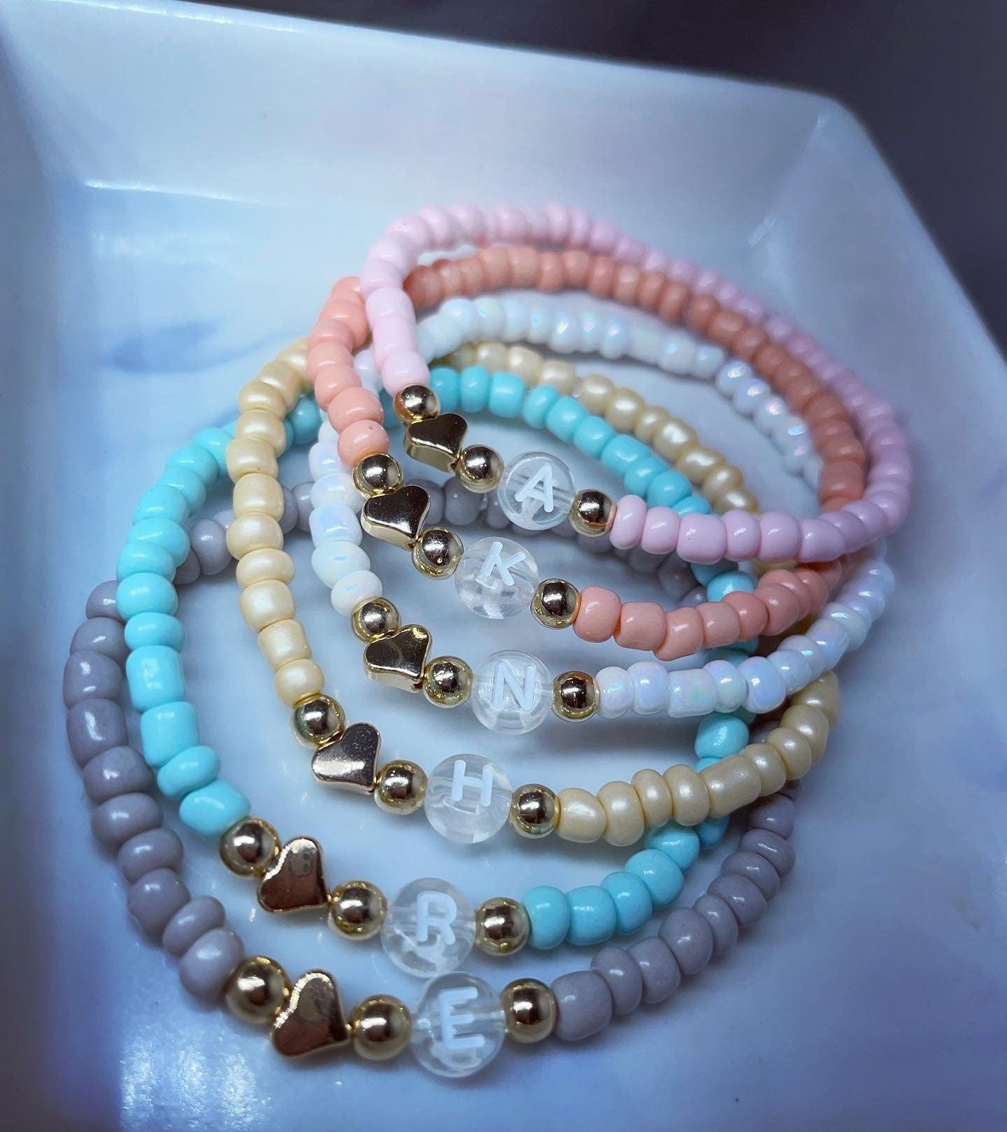 Personalised initial glass seed bead bracelets hematite accent beads and 18k gold plated hearts