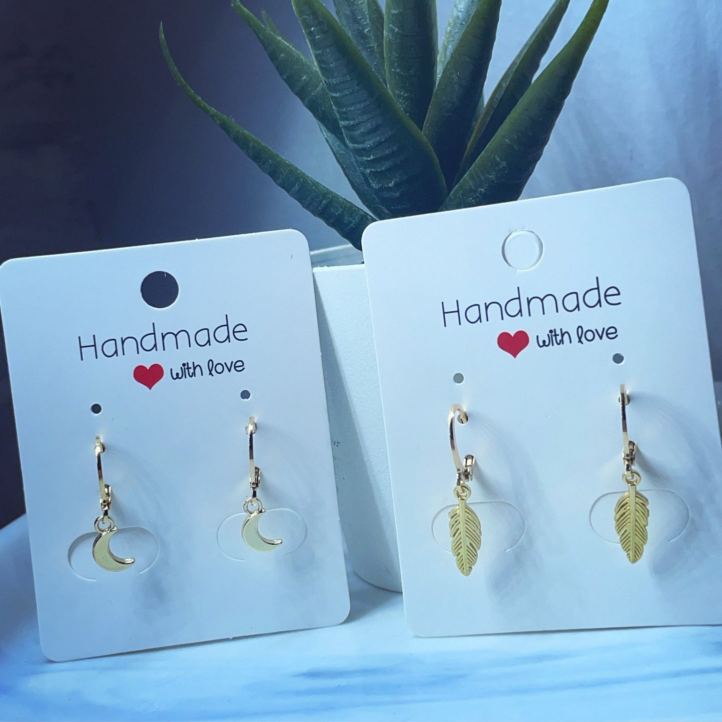 Gold huggie hoops crescent moon and feather